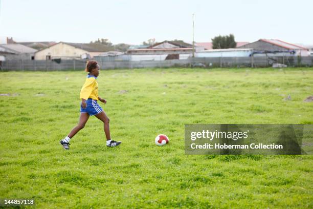 Girl Kicking Soccer Ball