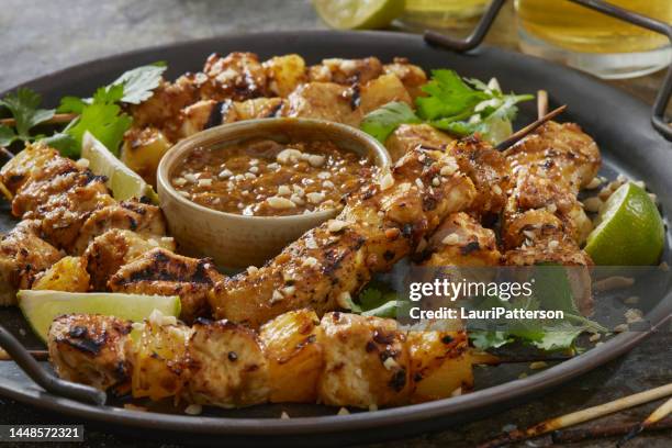 bbq pineapple chicken skewers in a peanut sauce - chicken satay stock pictures, royalty-free photos & images