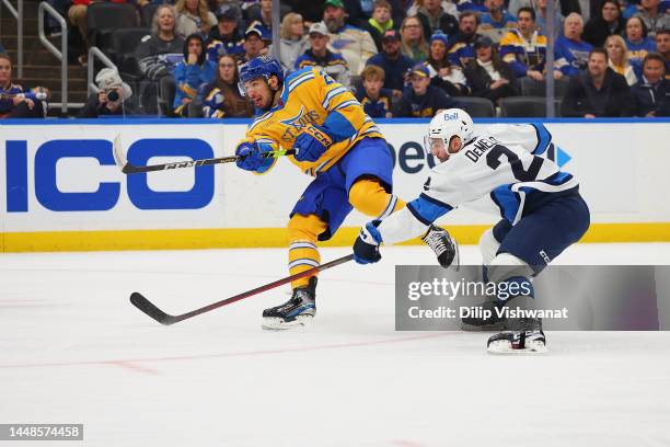 Jordan Kyrou of the St. Louis Blues shoots the puck against the Winnipeg Jets at Enterprise Center on December 8, 2022 in St Louis, Missouri.