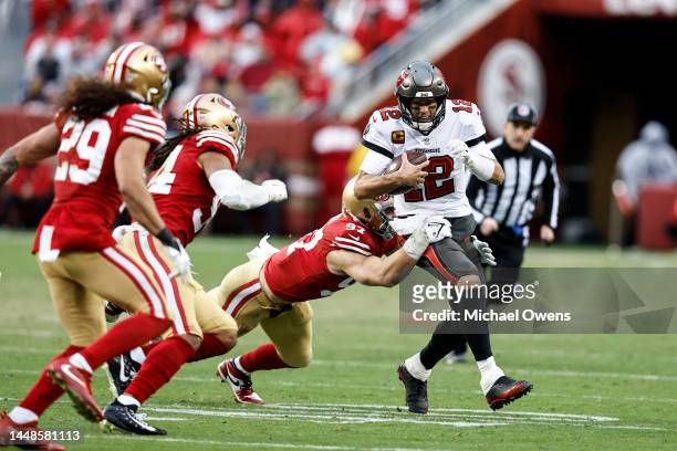 Tom Brady of the Tampa Bay Buccaneers is tackled by Nick Bosa of the San Francisco 49ers during an NFL football game between the San Francisco 49ers...