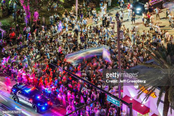 Miami Beach, Florida, police containing crowds of Argentinian soccer, futbol fans celebrating FIFA World Cup victory.