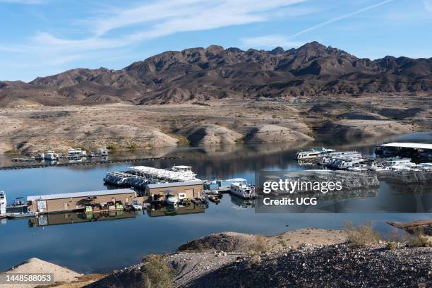 Strandlines left by falling lake levels and existing boat docks Callville Bay, Lake Mead, Nevada.