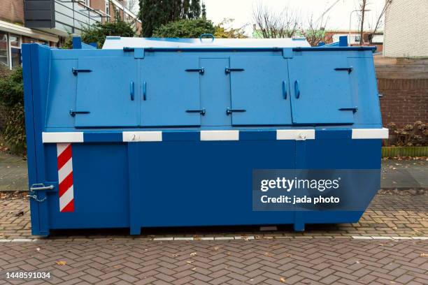 large blue steel waste container with closed steel shutters - afvalcontainer stockfoto's en -beelden