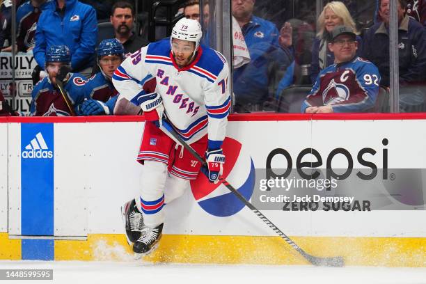 Andre Miller of the New York Rangers crashes against the boards against the Colorado Avalanche at Ball Arena on December 09, 2022 in Denver, Colorado.