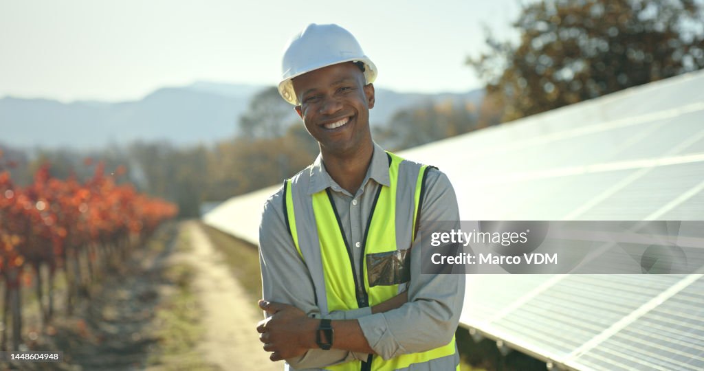Portrait, solar energy or engineering manager by solar panels roof in a nature farm smiles with pride for success. Innovation, construction or black man working on sustainability development project