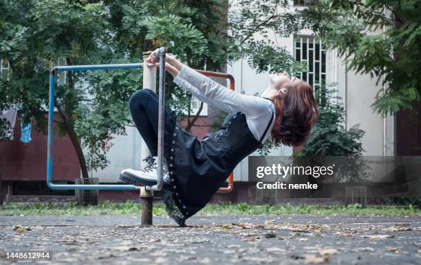 attractive young woman in an urban setting - goth stock pictures, royalty-free photos & images