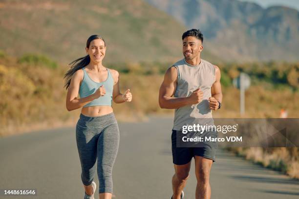 runner couple, street and nature in summer, mountains or countryside in fitness workout, wellness or health. man, woman and teamwork running on road for training, exercise or self care in sunshine - roupa desportiva imagens e fotografias de stock