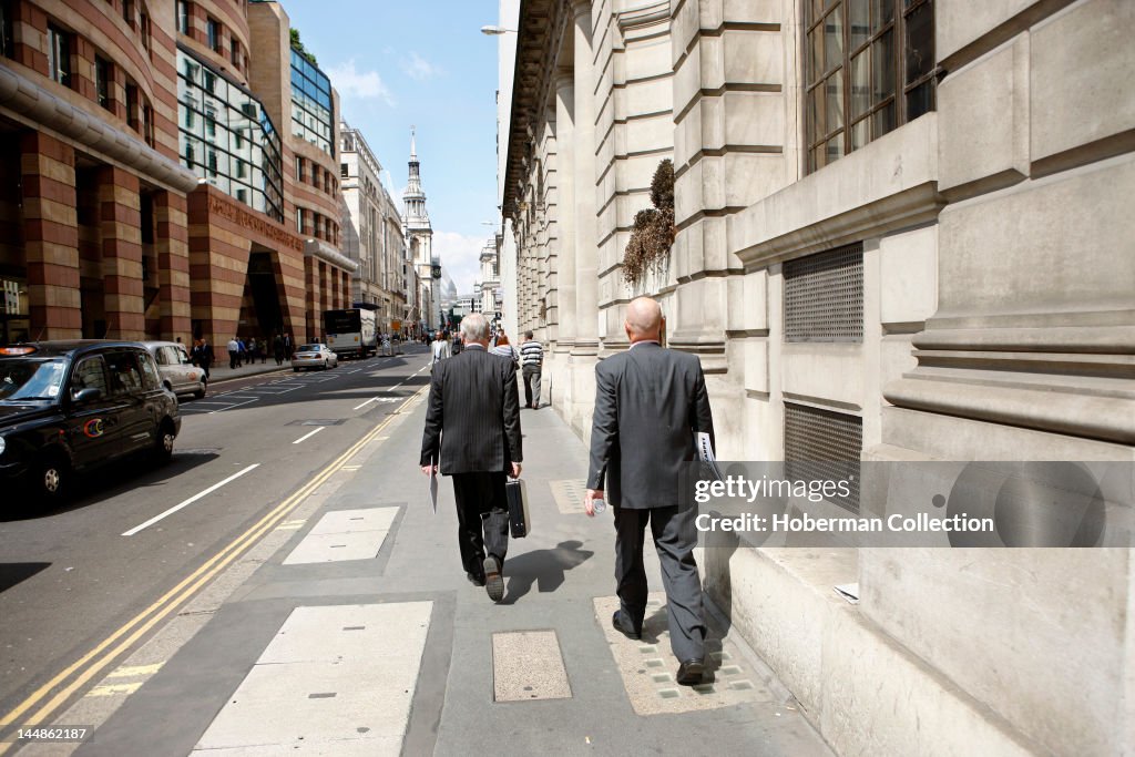 Businessmen Walking in Bank, London