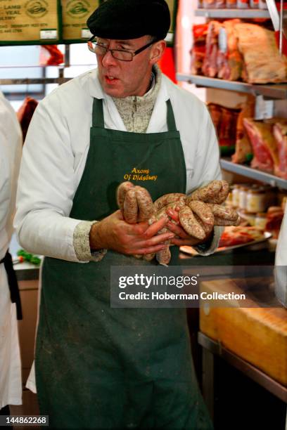 Butcher with Sausages, England