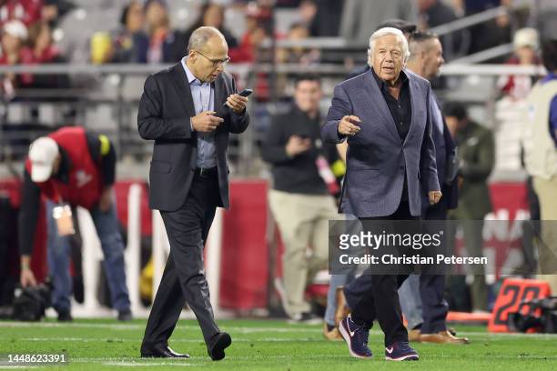 Owner Robert Kraft of the New England Patriots and son Jonathan Kraft walk on the field prior to the game against the Arizona Cardinals at State Farm...