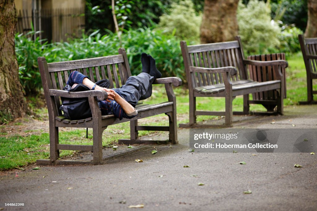 Man Sleeping on a Park Bench, London