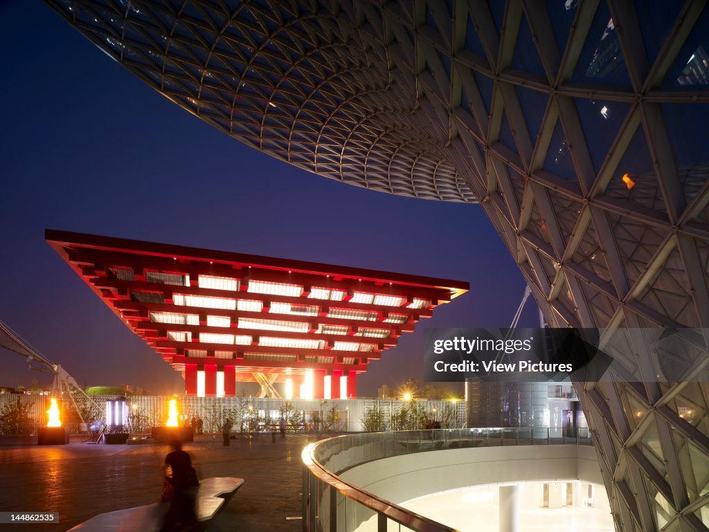 Shanghai Expo 2010 Chinese PavilionShanghaiChina Architect:  He Jingtang 2010 Shanghai Expo 2010 Chinese Pavilion  He Jingtang Shanghai 2010  View Of Illuminated Pavilion At Night With Detail Of Axis Steel Glass Structure