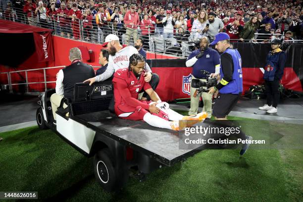 Kyler Murray of the Arizona Cardinals is carted off the field after being injured against the New England Patriots during the first quarter of the...