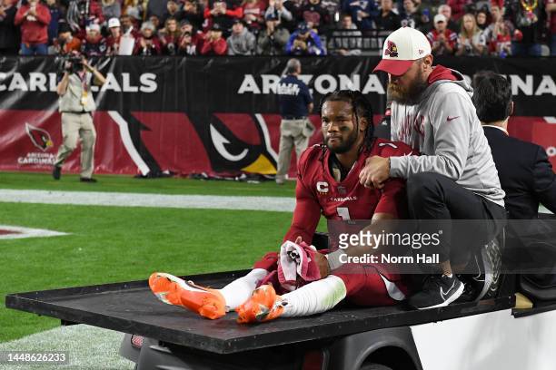Kyler Murray of the Arizona Cardinals is carted off the field after being injured against the New England Patriots during the first quarter of the...