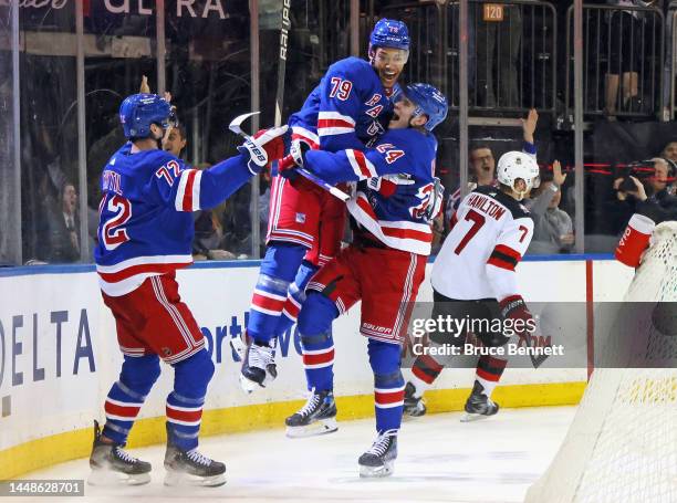 Kaapo Kakko of the New York Rangers celebrates his goal at 14:05 of the second period against the New Jersey Devils and is joined by Filip Chytil and...