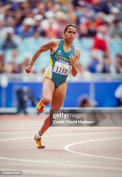 Cathy Freeman of Australia runs a heat of the Women's 200 meter event of the 2000 Summer Olympics track and field competition on September 27, 2000...
