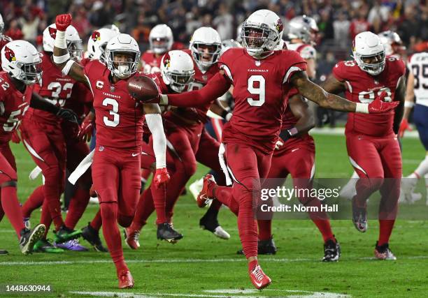 Isaiah Simmons of the Arizona Cardinals celebrates with his teammates after intercepting a pass by Mac Jones of the New England Patriots during the...