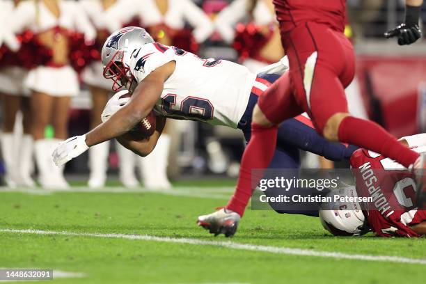 Kevin Harris of the New England Patriots scores a 14 yard touchdown against Jalen Thompson of the Arizona Cardinals during the second quarter of the...