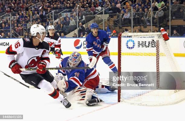 Jack Hughes of the New Jersey Devils scores a second period goal against Igor Shesterkin of the New York Rangers at Madison Square Garden on December...