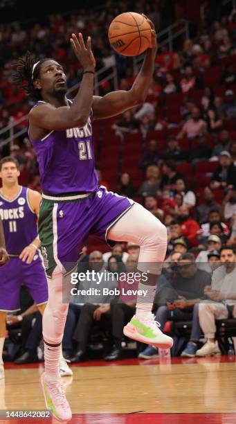 Jrue Holiday of the Milwaukee Bucks drives for a layup against the Houston Rockets at Toyota Center on December 11, 2022 in Houston, Texas. NOTE TO...