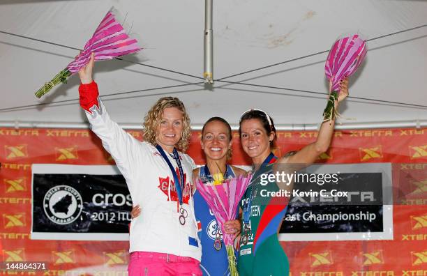 Melanie McQuaid of Canada, Lesley Paterson of Great Britain, Carla Van Huyssteen of South Africa celebrate on the podium after the 2012 ITU World...
