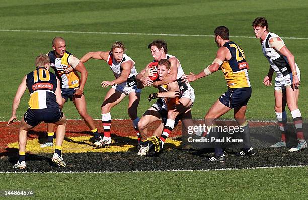 Lenny Hayes of the Saints tackles Adam Selwood of the Eagles during the round eight AFL match between the West Coast Eagles and St Kilda Saints at...