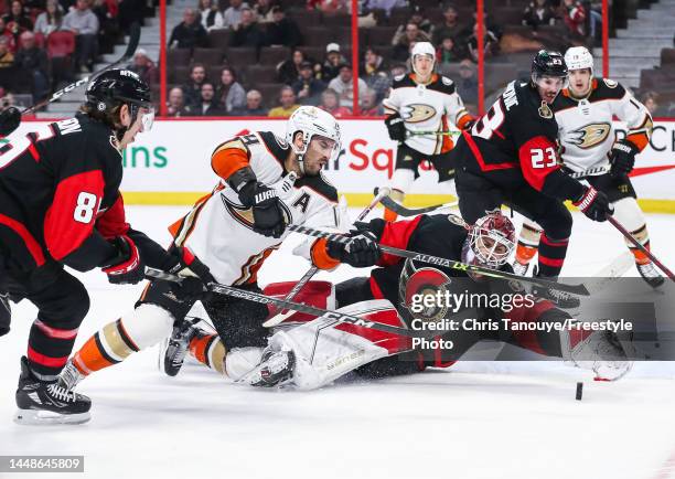 Cam Talbot of the Ottawa Senators makes a save against Adam Henrique of the Anaheim Ducks during the third period at Canadian Tire Centre on December...