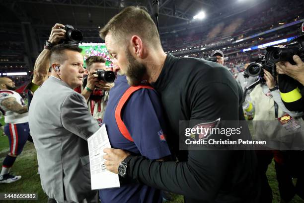 Head coach Kliff Kingsbury of the Arizona Cardinals hugs head coach Bill Belichick of the New England Patriots after the game at State Farm Stadium...