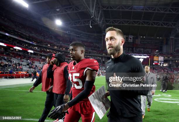 Head coach Kliff Kingsbury of the Arizona Cardinals walks off the field after being defeated by the New England Patriots in the game at State Farm...