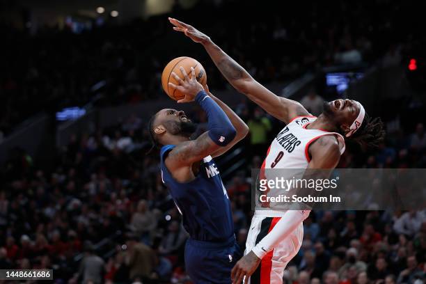 Jerami Grant of the Portland Trail Blazers draws a charge from Jaylen Nowell of the Minnesota Timberwolves during the second half at Moda Center on...