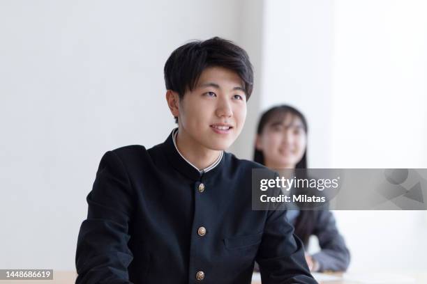 high school student studying at cram school - japanese school uniform stock pictures, royalty-free photos & images