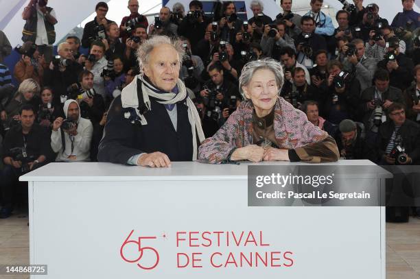 Actor Jean-Louis Trintignant and actress Emmanuelle Riva pose at the "Amour" Photocall during the 65th Annual Cannes Film Festival at Palais des...