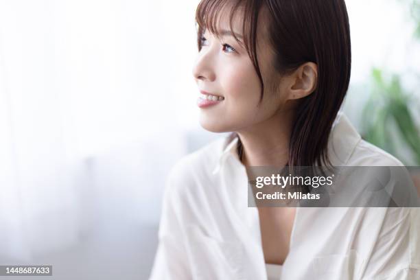 portrait of a woman in a white shirt - japanese profile stock pictures, royalty-free photos & images