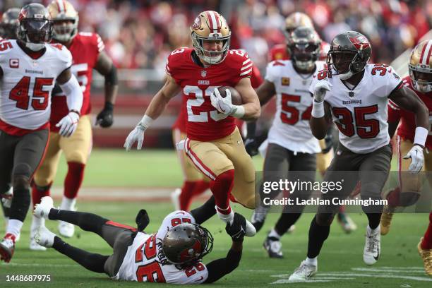 Christian McCaffrey of the San Francisco 49ers runs the ball against the Tampa Bay Buccaneers in the first quarter at Levi's Stadium on December 11,...