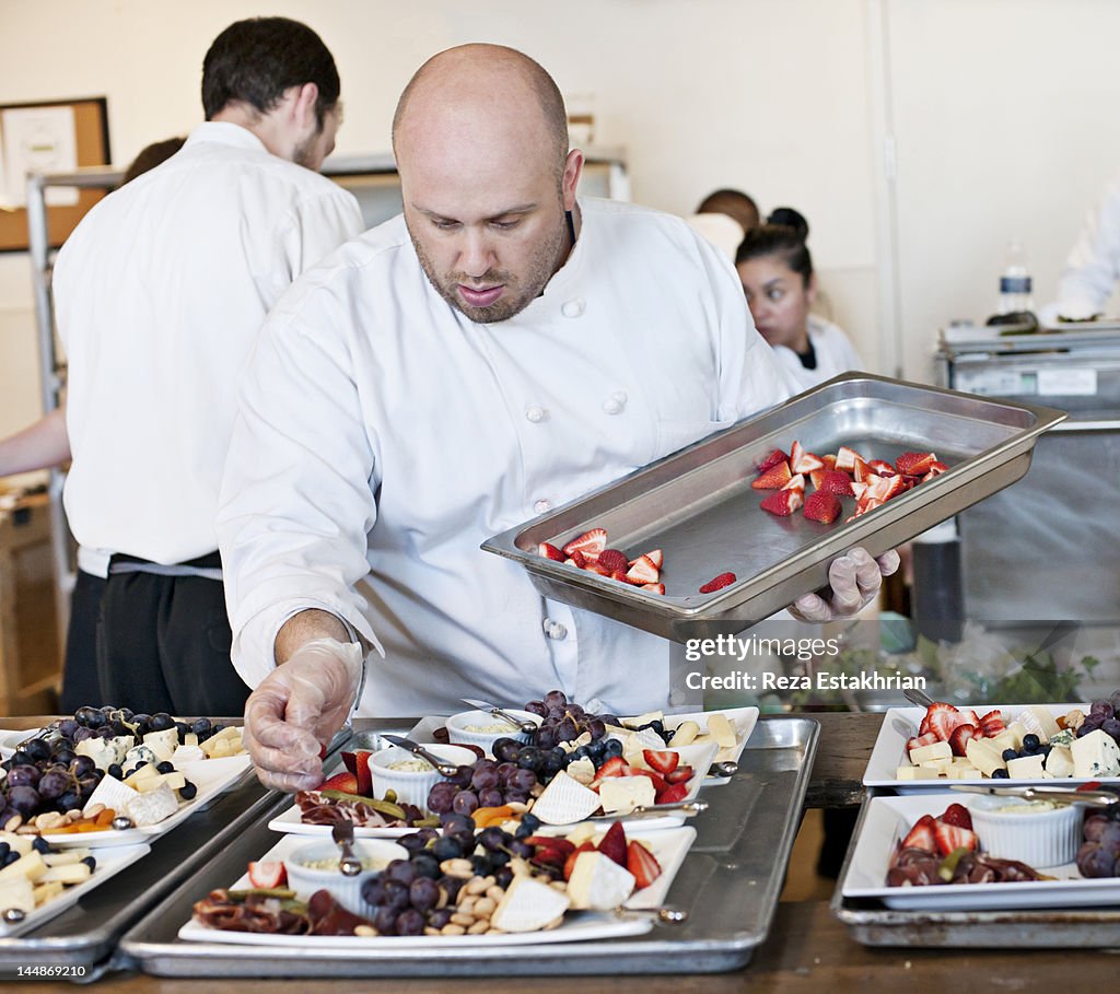 Chef prepares appetizers at event