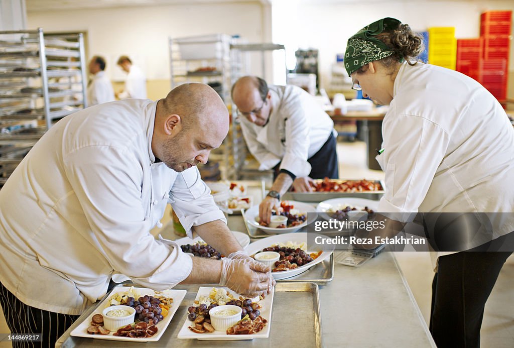 Chefs prepare appetizaers at event