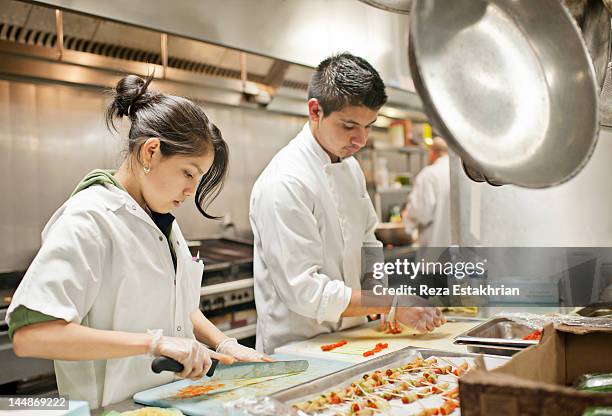 chefs prepare appetizers - teenager cooking stock pictures, royalty-free photos & images