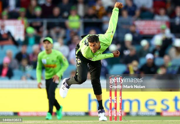 Gurinder Sandhu of the Thunder bowls during the Men's Big Bash League match between the Sydney Thunder and the Melbourne Stars at Manuka Oval, on...