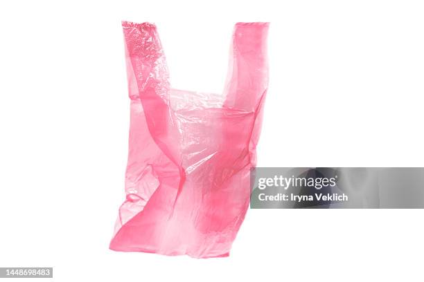 white cellophane plastic pastel trendy color of the year 2023 viva magenta purple pink background. - saco de plástico imagens e fotografias de stock
