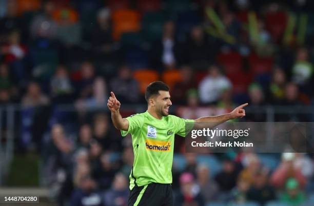 Fazalhaq Farooqi of the Thunder celebrates taking a wicket during the Men's Big Bash League match between the Sydney Thunder and the Melbourne Stars...