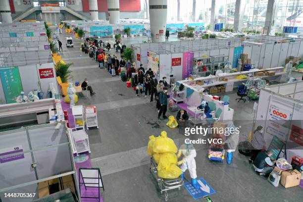 Cured COVID-19 patients wait to leave a makeshift hospital for COVID-19 patients at Canton Fair Complex on December 12, 2022 in Guangzhou, Guangdong...