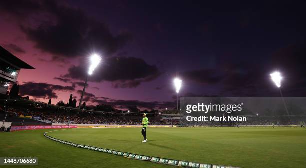 The sun sets during the Men's Big Bash League match between the Sydney Thunder and the Melbourne Stars at Manuka Oval, on December 13 in Canberra,...
