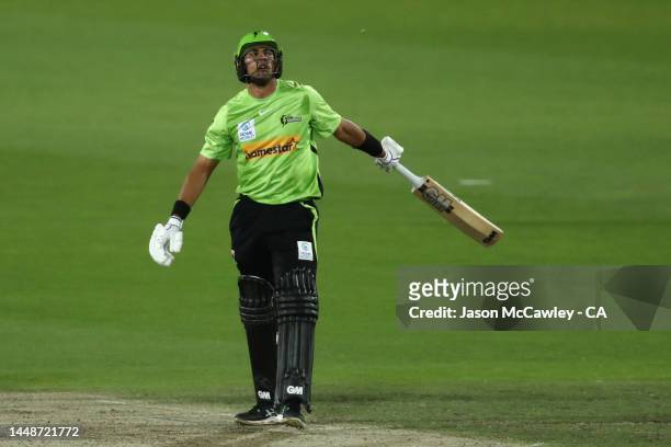 Jason Sangha of the Thunder reacts during the Men's Big Bash League match between the Sydney Thunder and the Melbourne Stars at Manuka Oval on...