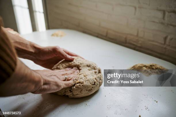 man kneading homemade bread - celiac disease stock pictures, royalty-free photos & images