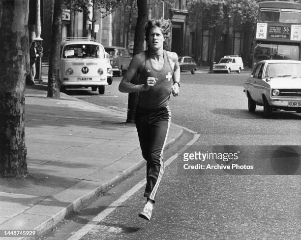 New Zealand runner, John Walker training along The Strand, London for the mile race at the IAC/Coca-Cola athletics meeting at Crystal Palace stadium,...