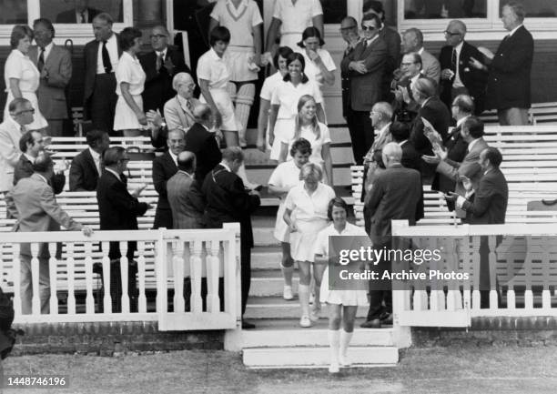 English ladies cricket captain Rachael Heyhoe Flint leads her team out to play Australia in an historic one-day International match, Lords's Cricket...