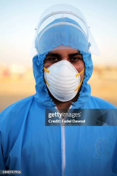 On the working day of the ambulance team, which transports Corona cases from their homes to isolation hospitals on May 7, 2020 in Cairo, Egypt. Up...