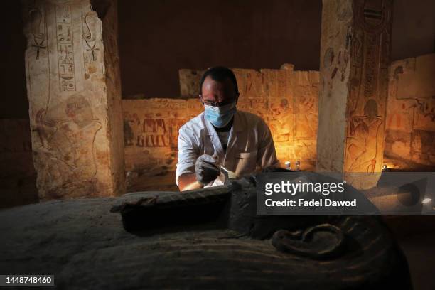 An archeologist wars a mask on a archaeological discovery on October 3, 2020 in Cairo, Egypt. Up until 13 December 2022, Egypt has recorded 515,645...