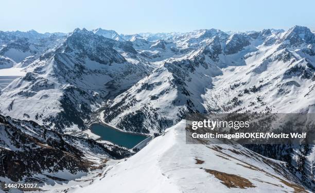reservoir, peaks and mountains in winter, sellraintal, stubai alps, kuehtai, tyrol, austria - sellrain stock pictures, royalty-free photos & images