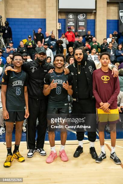 Bryce James, LeBron James, Bronny James, Carmelo Anthony and Kiyan Anthony pose together at the Sierra Canyon vs Christ The King boys basketball game...